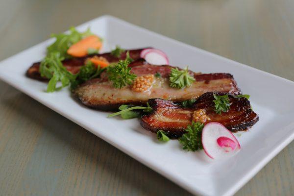 Nicks on Broadway's house-smoked bacon with cider and punchy dollops of whole-grain mustard. (Channaly Philipp/The Epoch Times)