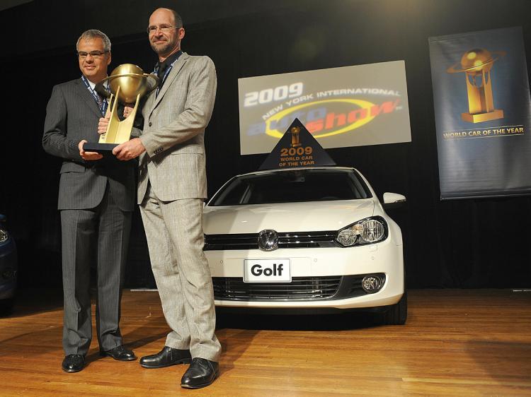 <a><img class="size-medium wp-image-1828857" title="Volkswagen America President Stephen Jacoby (L) and Klaus Bischoff, Dorector Volkswagen Design, hold the trophy a they pose with the Volkswagen Golf, Named the 2009 World Car of the Year at the New York International Auto Show.  (Stan Honda/AFP/Getty Images)" src="https://www.theepochtimes.com/assets/uploads/2015/09/goglgkl85872938.jpg" alt="Volkswagen America President Stephen Jacoby (L) and Klaus Bischoff, Dorector Volkswagen Design, hold the trophy a they pose with the Volkswagen Golf, Named the 2009 World Car of the Year at the New York International Auto Show.  (Stan Honda/AFP/Getty Images)" width="320"/></a>